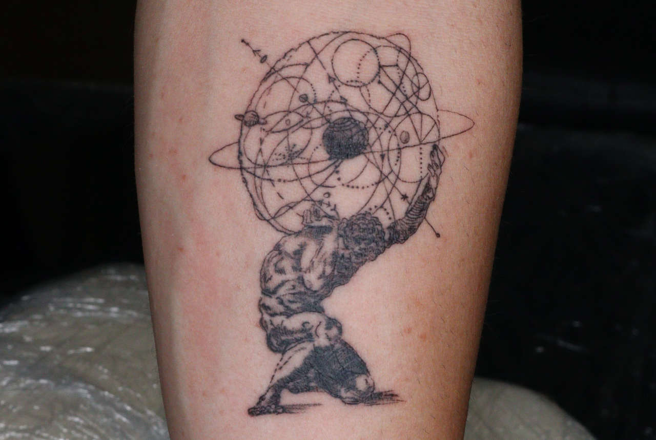 Black-and-grey Atlas kneeling under an armillary celestial sphere on the calf